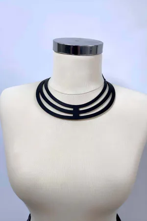 Black vegan leather multi-strap choker harness on mannequin