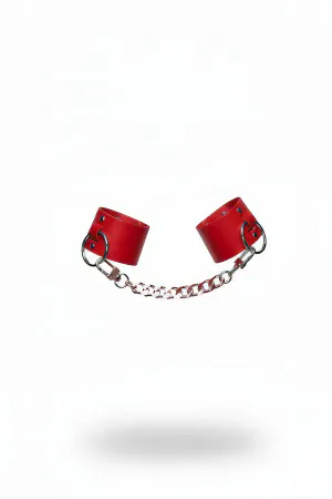 Red faux leather wrist cuffs linked by a silver chain