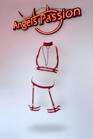 Red faux leather body harness with detached chain and garter straps