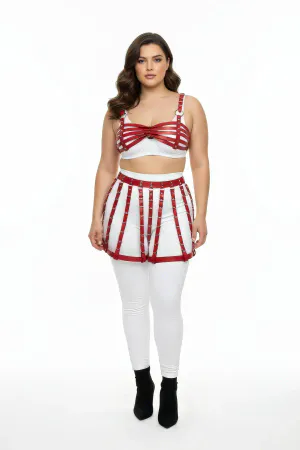 Red faux leather cage skirt and bra harness set on model