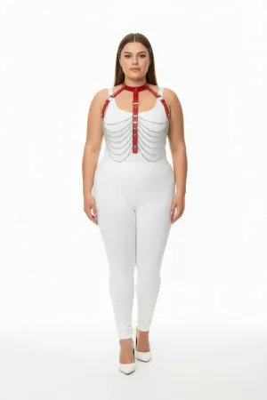 Red faux leather body harness with cascading silver chains, worn by a model.