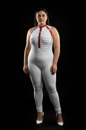 Red faux leather body harness with cascading silver chains, worn by a model.