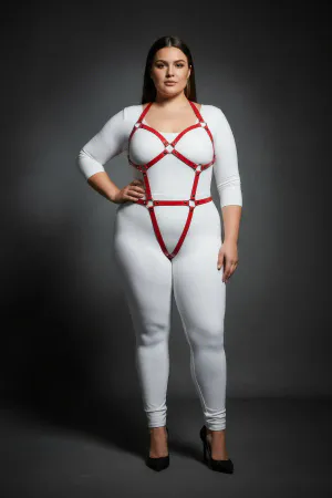 Red vegan leather full body harness with O-ring details on model.