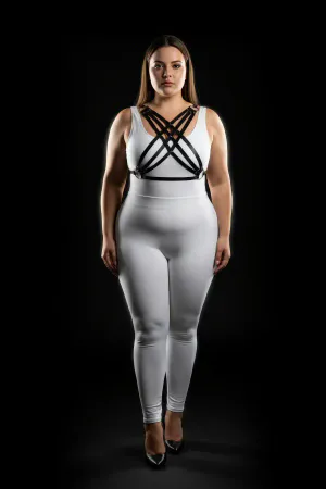 Black faux leather strappy chest harness worn by a plus-size model