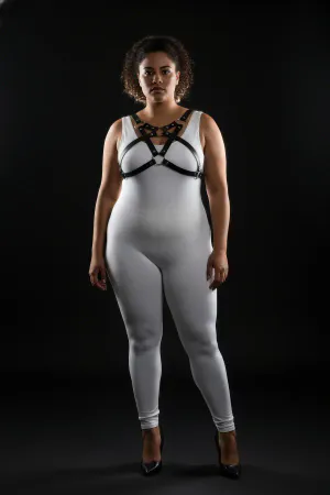 Black vegan leather chest harness with O-ring detail worn by a plus-size model