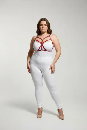 Red faux leather strappy body harness on a plus-size model