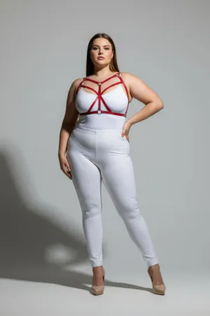 Red faux leather strappy body harness on a plus-size model