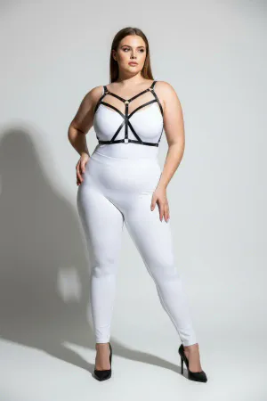 Black faux leather strappy body harness with adjustable straps and O-ring detail