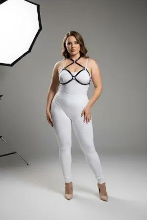Black faux leather strappy chest harness with O-ring details, worn by a plus-size model.