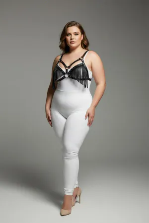 Black faux leather fringe body harness with central O-ring worn by a plus-size model.
