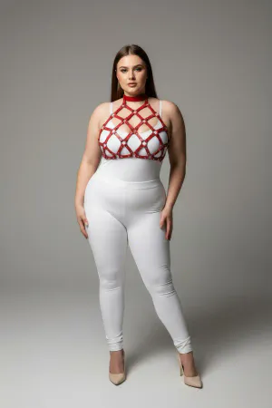 Red geometric cage halter harness with nail details worn by a plus-size model
