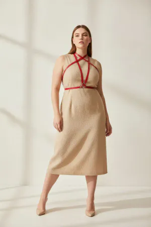 Red Vegan Leather Overbust Criss-Cross Body Harness with O-Ring worn by a woman over a black dress