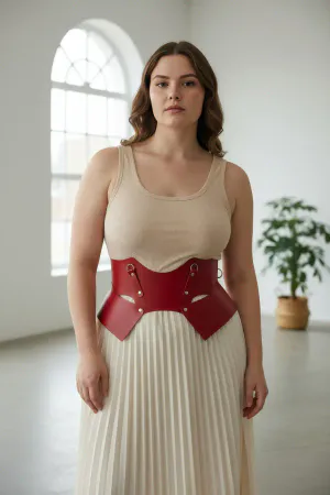 Red Faux Leather Waist Harness with Sculpted Panels on a woman in a cafe, light-colored blouse and pants